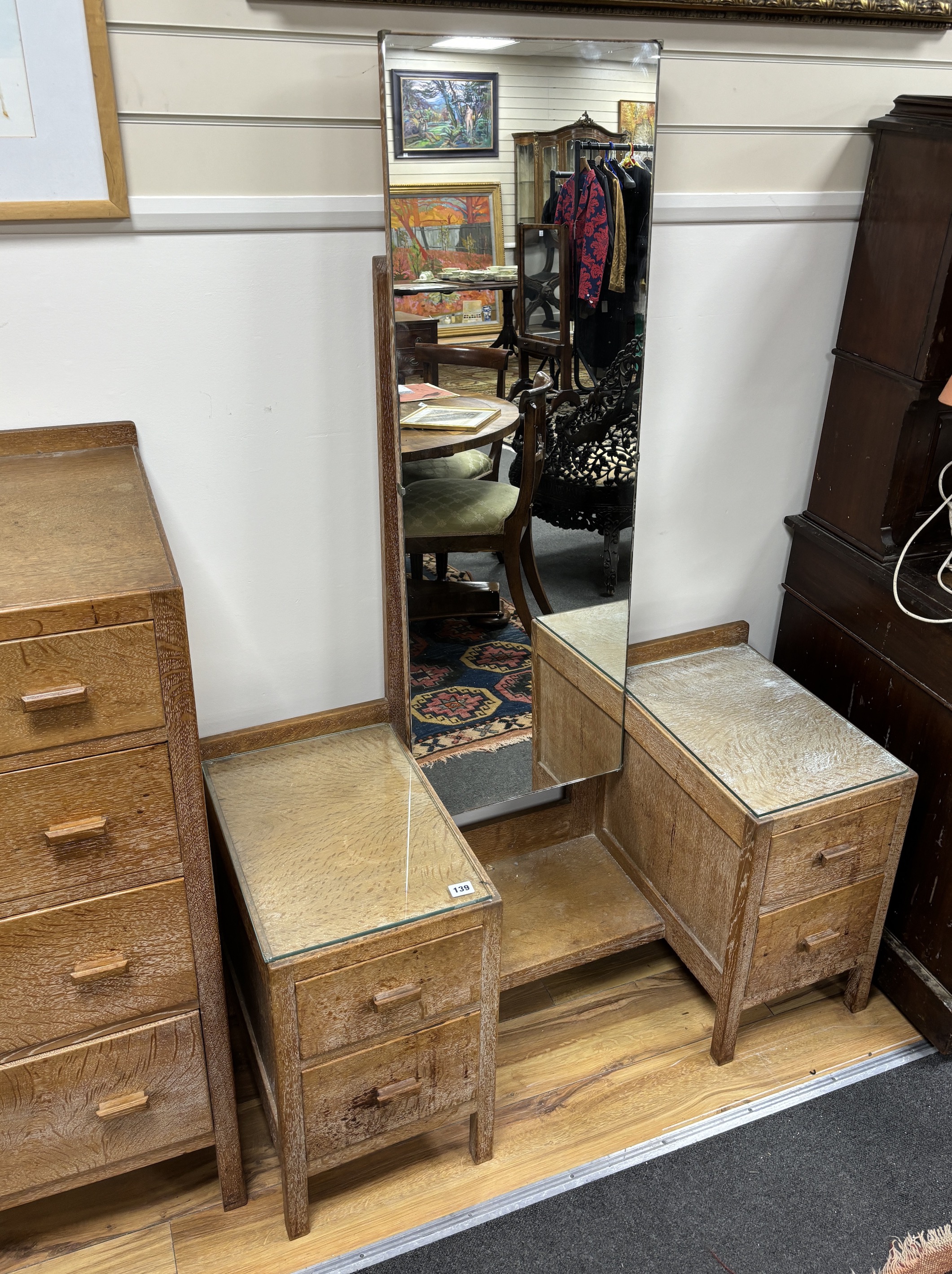 A Heals, London, limed oak six drawer chest, width 76cm, depth 48cm, height 104cm, dressing table and bedside cabinet